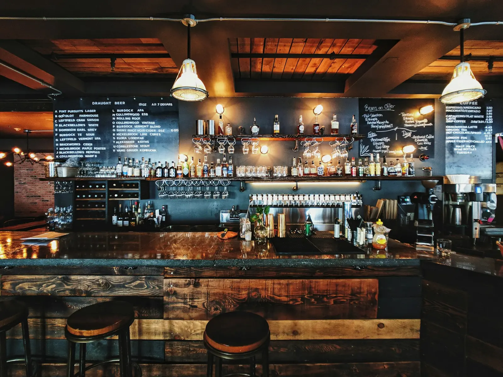 Bar back-lit with warm pendant lights