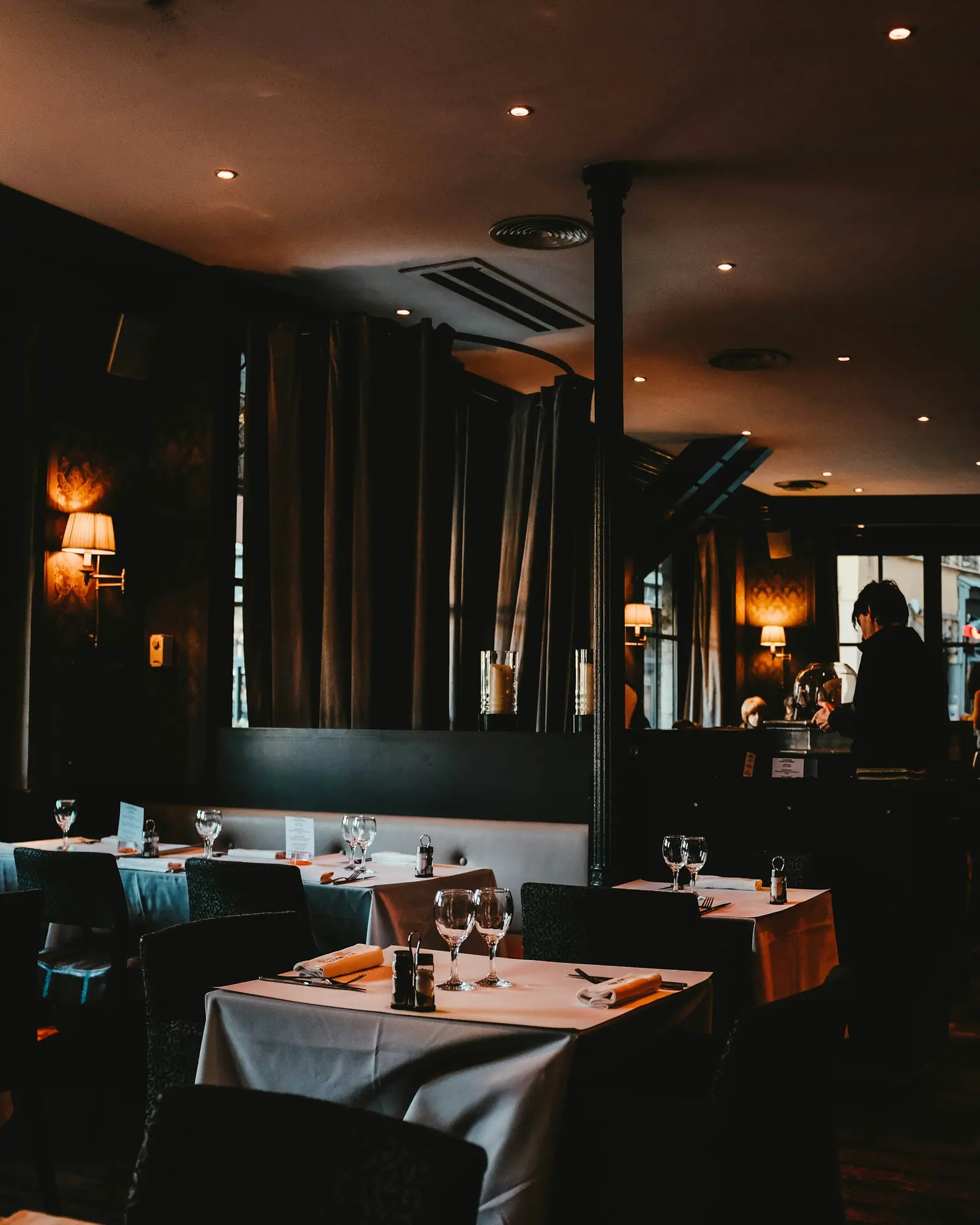 Intimate corner tables in low light